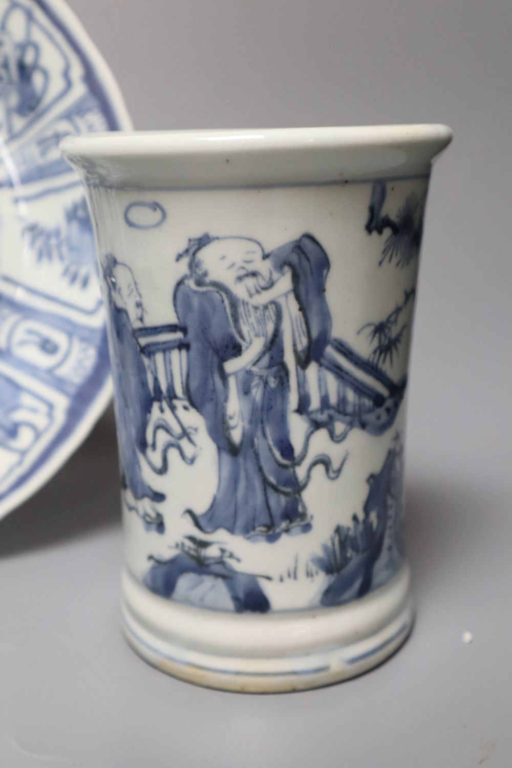 A Chinese blue and white dish, a vase and an English tea bowl